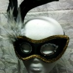 black_with_gold_trim_and_feathers